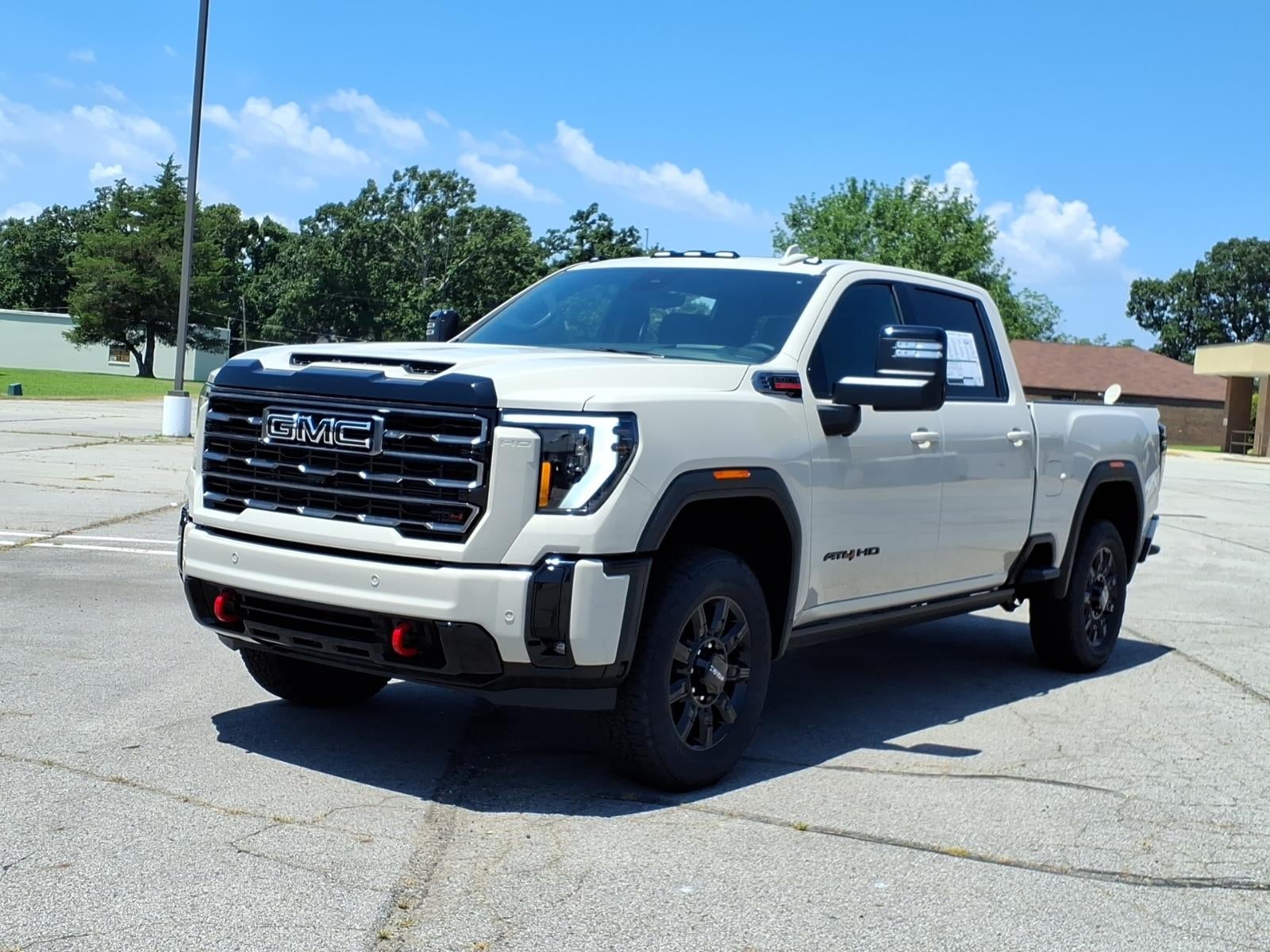2026 GMC Sierra 2500 HD AT4 in Coastal Dune — front three-quarter view