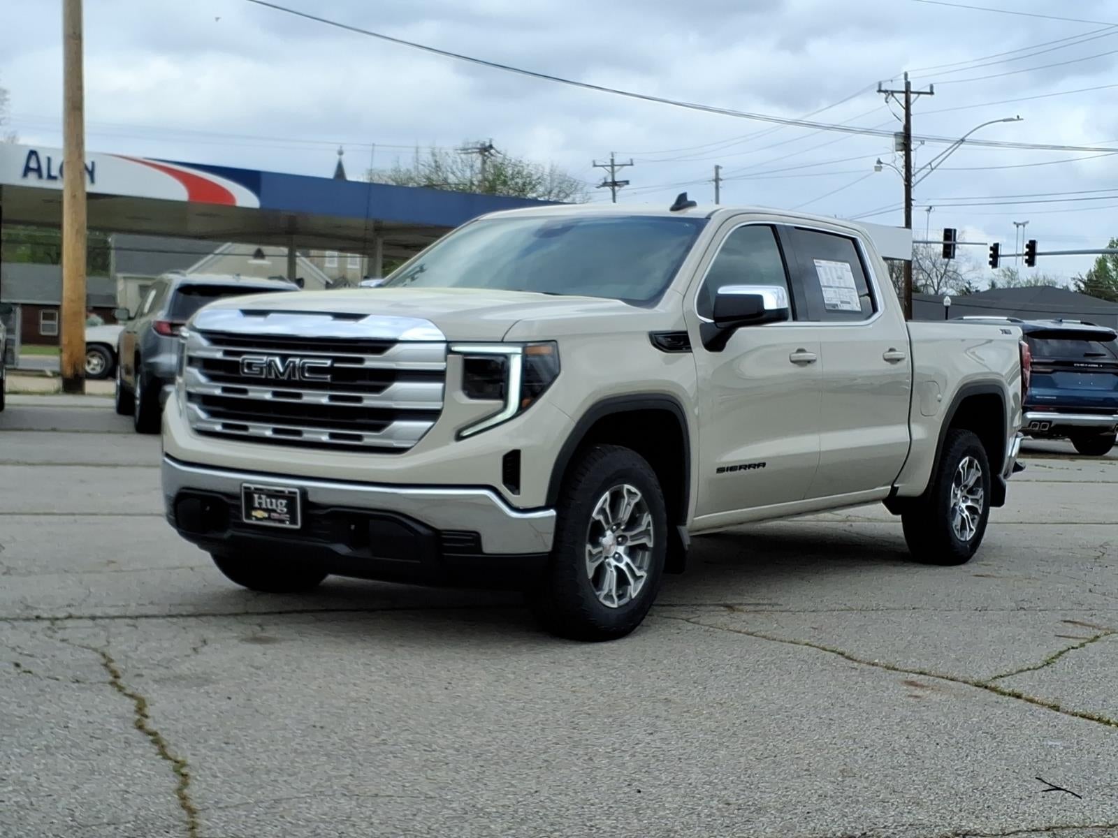 2026 GMC Sierra 1500 SLE in Coastal Dune — front three-quarter view